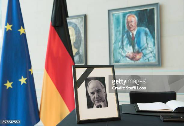 Book of condolence for former German Chancellor Helmut Kohl is placed in front of the Chancellor's gallery next to a portrait of him at the...