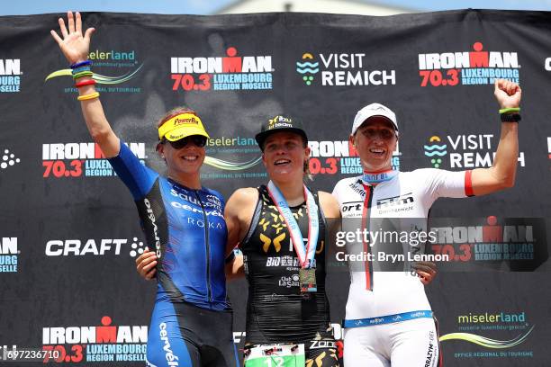 Susie Cheetham of Great Britain, Alexandra Tondeur of Belgium and Katja Konschak of Germany stand on the podium after the Women's Ironman 70.3...