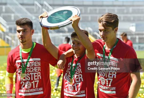 The team of FC Bayern Muenchen celebrates winning the B Juniors German Championship Final against SV Werder Bremen at Stadion an der Gruenwalder...