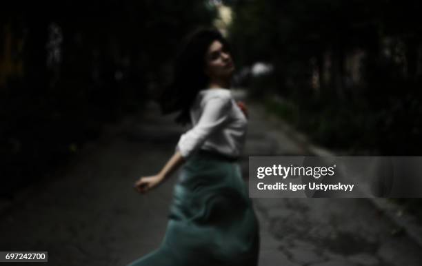 Defocused photo of woman running on the street