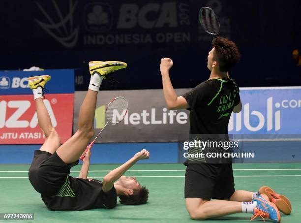 Liu Yuchen and Li Junhui of China celebrate after beating Mathias Boe and Carsten Mogensen of Denmark to win the men's doubles final at the Indonesia...