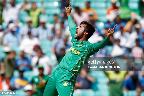 Pakistan's Mohammad Amir celebrates taking the wicket of India's Rohit Sharma, lbw for 0 during the ICC Champions Trophy final cricket match between...
