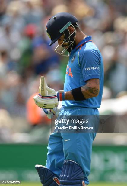 Virat Kohli of India leaves the field after being dismissed during the ICC Champions Trophy final match between India and Pakistan at the Kia Oval...