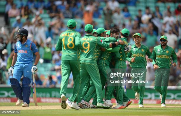 Mohammad Amir of Pakistan is congratulated after dismissing Rohit Sharma of India during the ICC Champions Trophy final match between India and...