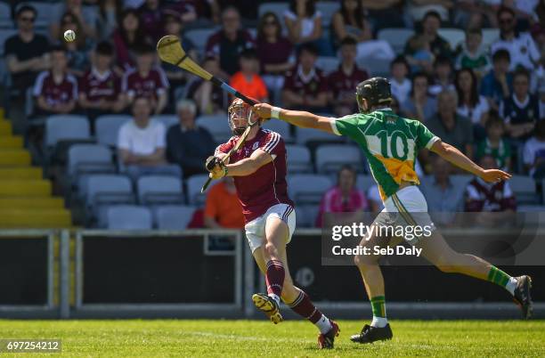 Laois , Ireland - 18 June 2017; Conor Whelan of Galway scores a point while under pressure from Pádraic Guinan of Offaly during the Leinster GAA...