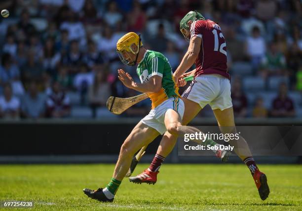 Laois , Ireland - 18 June 2017; Niall Burke of Galway scores a point while under pressure from Paddy Murphy of Offaly during the Leinster GAA Hurling...