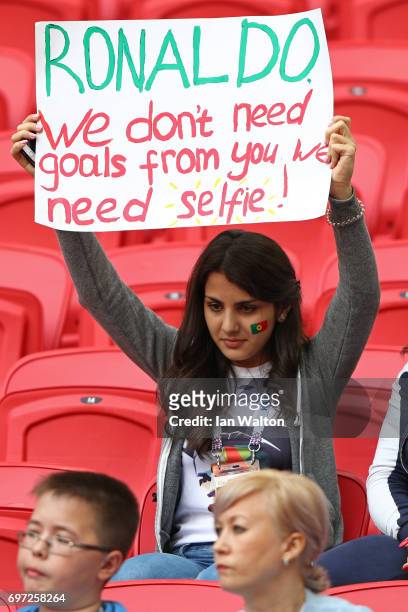 Portugal supporter raises a sign asking Cristiano Ronaldo of Portugal to take a selfie with her prior to the FIFA Confederations Cup Russia 2017...
