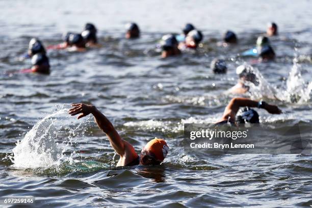 Athletes start the Ironman 70.3 Luxembourg-Region Moselle race on June 18, 2017 in Remich, Luxembourg.