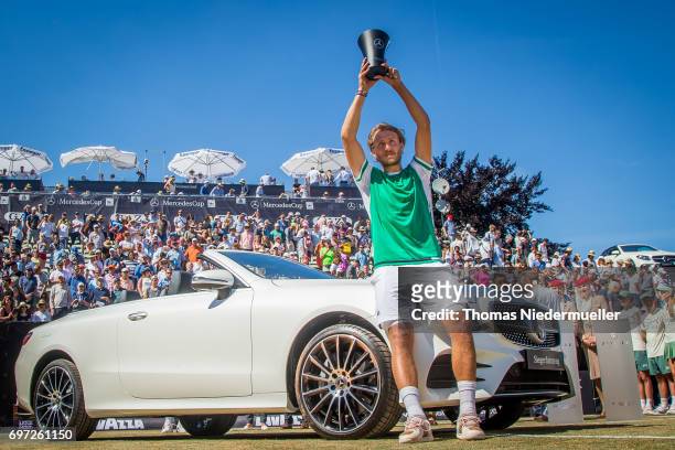 Lucas Pouille of France shows the trophy after the MercedesCup men's singles final between Feliciano Lopez of Spain and Lucas Pouille of France at...