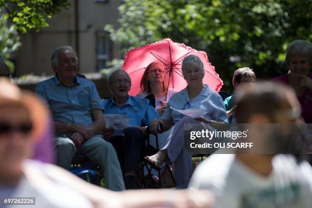 Members of the public attend a 'Great Get Together' community service and picnic in memory of murdered Member of Parliament Jo Cox, marking the first...