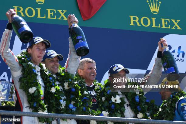 Germany's Fritz Enzinger poses with New Zealand's driver Brendon Hartley, New Zealand's driver Earl Bamber and Germany's driver Timo Bernhard on the...