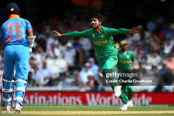 Mohammad Amir of Pakistan celebrates after taking the wicket of India's Shikhar Dhawan during the ICC Champions Trophy Final match between India and...