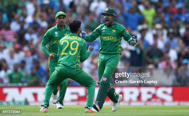 Pakistan captain Sarfraz Ahmed celebrates with Shadab Khan after catching out Kedar Jadhav of India during the ICC Champions Trophy Final between...