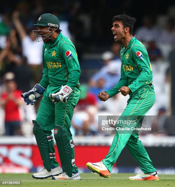Pakistan captain and wicket keeper Sarfraz Ahmed celebrates after catching out India's Kedar Jadhav off of the bowling of Shadab Khan during the ICC...