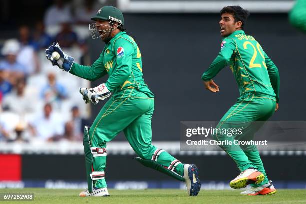 Pakistan captain and wicket keeper Sarfraz Ahmed celebrates after taking catching out India's Kedar Jadhav off of the bowling of Shadab Khan during...