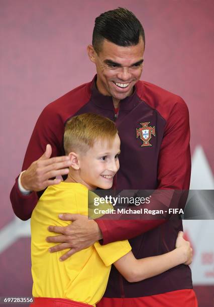 Pepe of Portugal and a mascot embrace in the tunnel prior to the FIFA Confederations Cup Russia 2017 Group A match between Portugal and Mexico at...