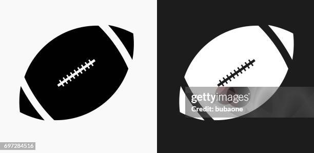 football icon on black and white vector backgrounds - black and white american football stock illustrations