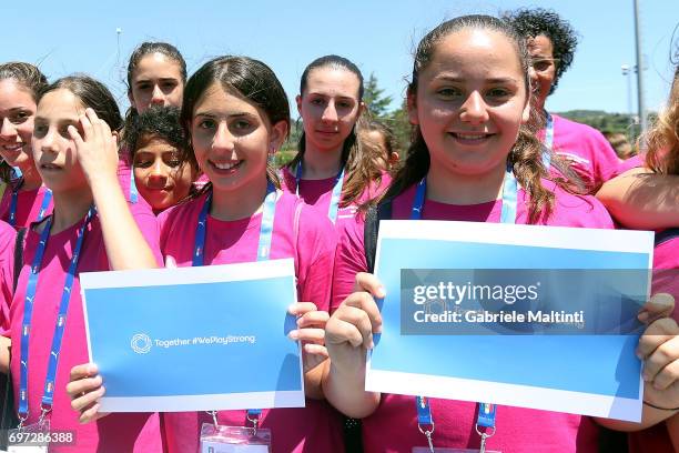 Young players pose for the camera during the Italian Football Federation during 9th Grassroots Festival at Coverciano on June 18, 2017 in Florence,...