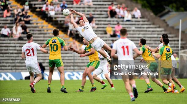 Monaghan , Ireland - 18 June 2017; Colm Cavanagh of Tyrone in action against Michael Murphy of Donegal during the Ulster GAA Football Senior...