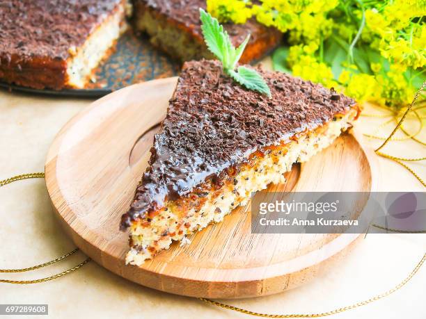homemade cake or pie with ricotta cheese, poppy seeds, apricot jam and dark chocolate, selective focus - poppy seed - fotografias e filmes do acervo