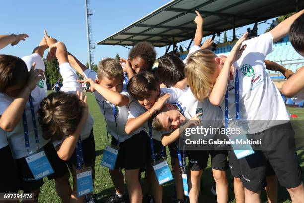 Young players dab as they pose for a photo during the Italian Football Federation during 9th Grassroots Festival at Coverciano on June 18, 2017 in...