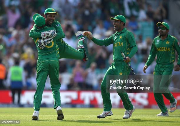 Pakistan captain Sarfraz Ahmed celebrates with Shoaib Malik after winning the ICC Champions Trophy Final between India and Pakistan at The Kia Oval...