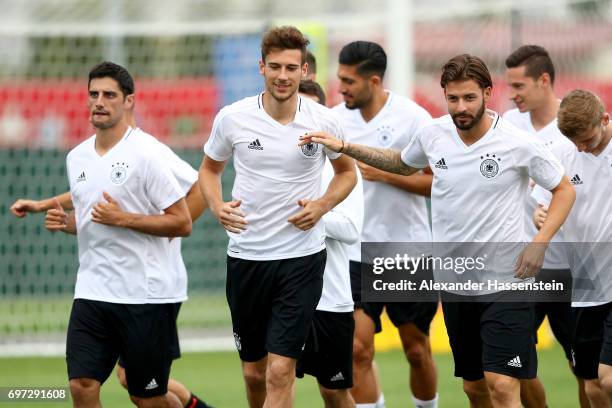 Leon Goretzka jokes with Marvin Plattenhardt during a team Germany training session at Park Arena training ground on June 18, 2017 in Sochi, Russia....