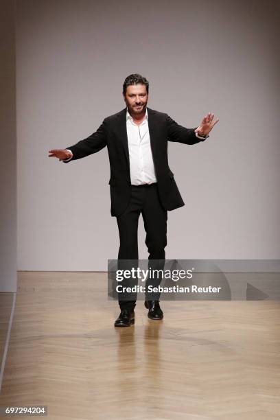 Designer Filippo Scuffi acknowledges the applause of the audience after the Daks show during Milan Men's Fashion Week Spring/Summer 2018 on June 18,...