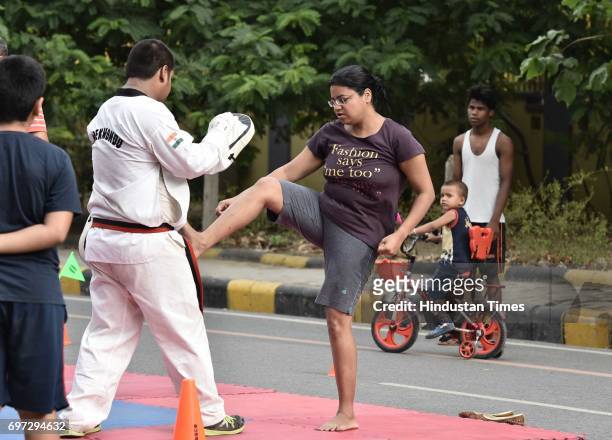 People participate on the Raahgiri Day at Sushant Lok near Galleria Market, organized by MCG, on June 18, 2017 in Gurugram, India. The day is a joint...
