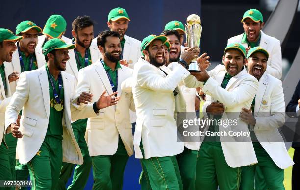 Pakistan lift the ICC Champions Trophy after being India during ICC Champions Trophy Final between India and Pakistan at The Kia Oval on June 18,...