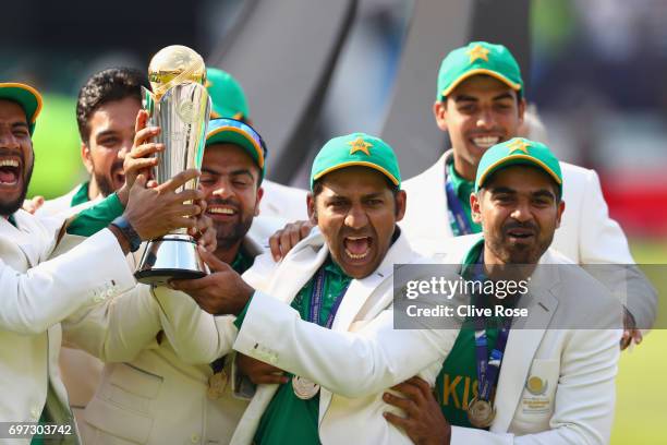 Sarfraz Ahmed of Pakistan lifts the winners trophy as Pakistan win the ICC Champions trophy cricket match between India and Pakistan at The Oval in...