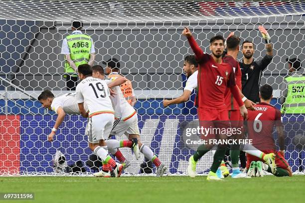 Mexico's defender Hector Moreno celebrates with team mates after scoring during the 2017 Confederations Cup group A football match between Portugal...