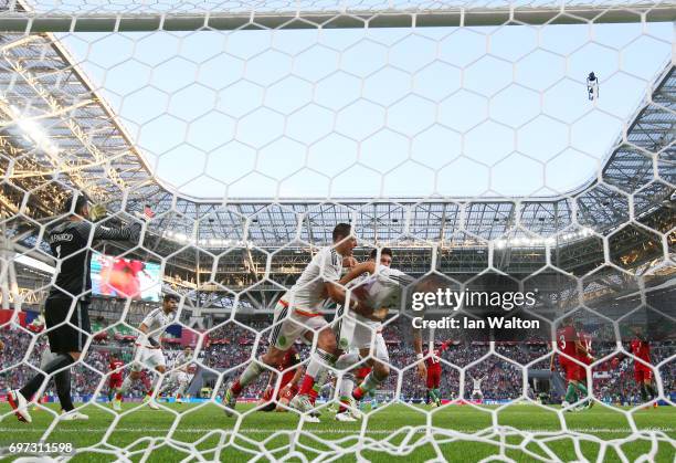 Hector Moreno of Mexico celebrates scoring his sides second goal with his Mexico team mates as Rui Patricio of Portugal reacts during the FIFA...