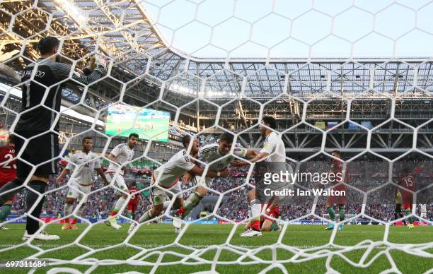 Hector Moreno of Mexico celebrates scoring his sides second goal with his Mexico team mates as Rui Patricio of Portugal reacts during the FIFA...