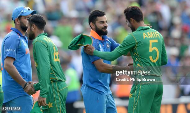 Mohammad Amir of Pakistan shakes hands with Virat Kohli of India after the ICC Champions Trophy final match between India and Pakistan at the Kia...