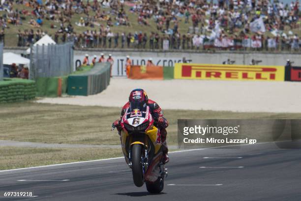 Stefan Bradl of Germany and Red Bull Honda World Superbike team lifts the front wheel during the Superbike Race 2 during the FIM Superbike World...