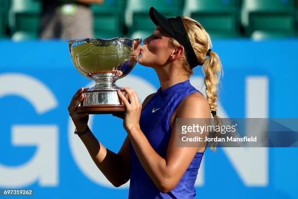 Donna Vekic of Croatia lifts the trophy after victory in her Women's Singles Final match against Johanna Konta of Great Britain during day 7 of the...