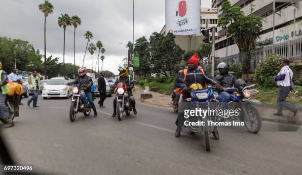 Nairobi, Kenya Motorcyclists in city traffic. Street scene in Nairobi, capital of Kenya on May 15, 2017 in Nairobi, Kenya.