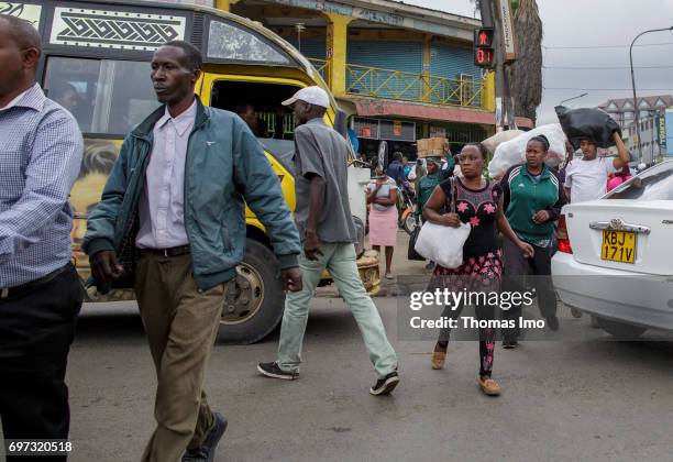 Nairobi, Kenya Pedestrians cross a street. Street scene in Nairobi, capital of Kenya on May 15, 2017 in Nairobi, Kenya.