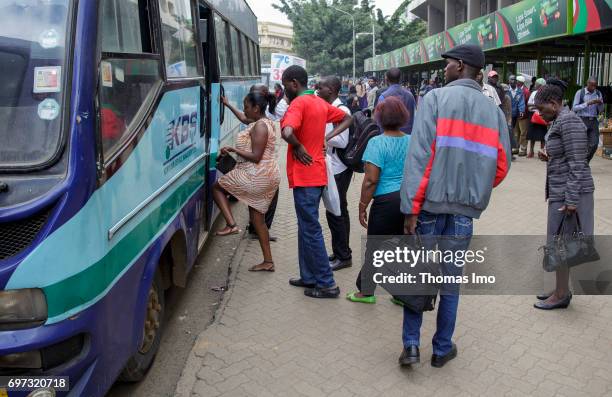 Nairobi, Kenya Passengers board a bus. Street scene in Nairobi, capital of Kenya on May 15, 2017 in Nairobi, Kenya.