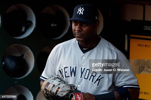Chris Carter of the New York Yankees stands in the dugout before the game against the Oakland Athletics at the Oakland Coliseum on June 15, 2017 in...
