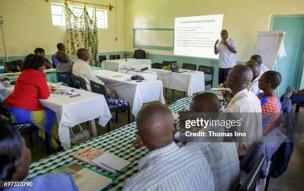 Kakamega County, Kenya African farmers during a training course in dairy farming with the focus on "weather data via SMS" at the Bukura Agricultural...
