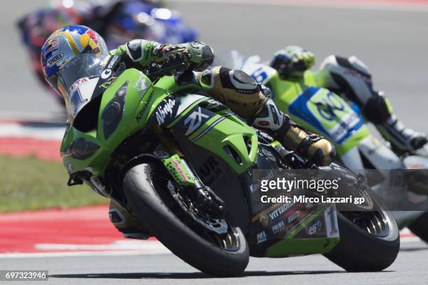 Kenan Sofuoglu of Turkey and Kawasaki Puccetti Racing leads Jules Cluzel of France and CIA Landlord Insurance Honda during the SuperSport Race during...
