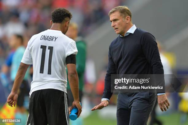 Stefan Kuntz, coach of Germany tallks to Serge Gnabry during the UEFA European Under-21 Championship Group C match between Germany and Czech Republic...