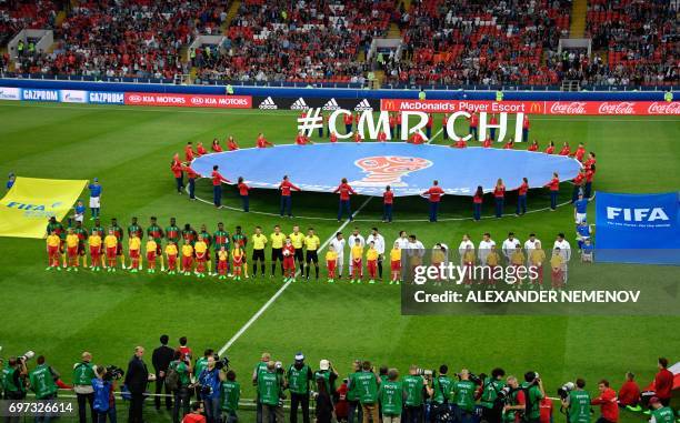 Teams pose ahead of the 2017 Confederations Cup group B football match between Cameroon and Chile at the Spartak Stadium in Moscow on June 18, 2017....