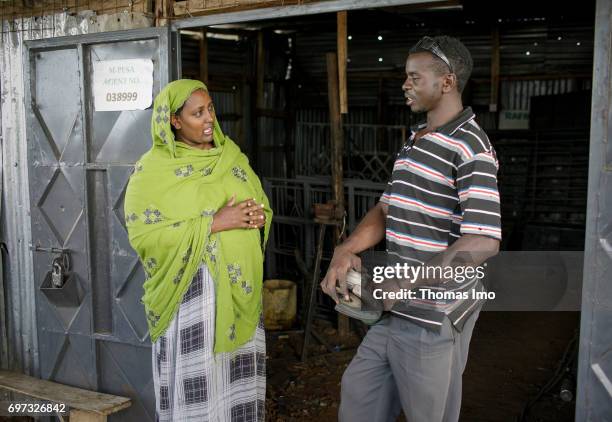 Talek, Kenya Fatuma Aden, owner of the welding shop Al-Tawakal, in conversation with an employee on May 17, 2017 in Talek, Kenya.