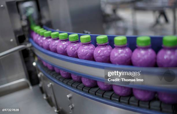 Thika, Kenya Plastic bottles are transported via a conveyor belt. Production of juice at beverage manufacturer Kevian Kenya Ltd. On May 18, 2017 in...