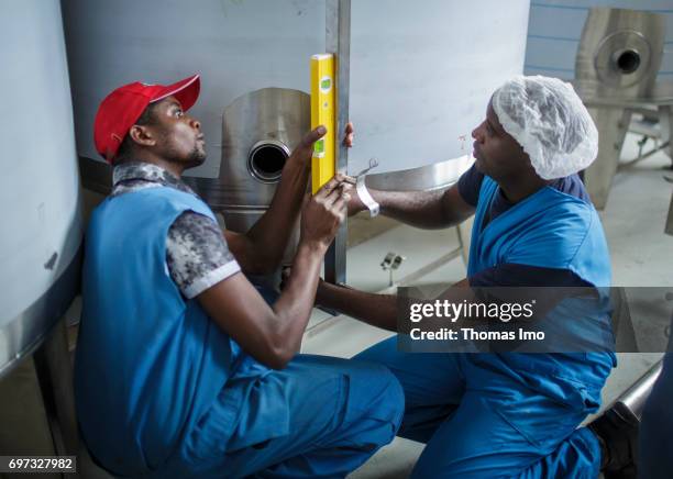 Thika, Kenya Employees install a technical plant at beverage manufacturer Kevian Kenya Ltd. On May 18, 2017 in Thika, Kenya.