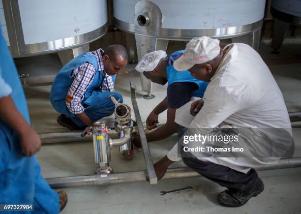 Thika, Kenya Employees repair a technical plant at beverage manufacturer Kevian Kenya Ltd. On May 18, 2017 in Thika, Kenya.