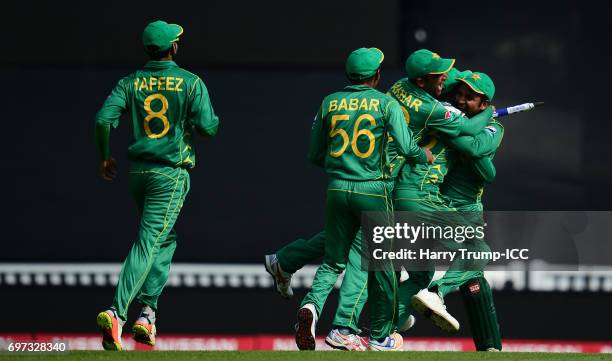 The Pakistan players celebrate after taking the final wicket to win the match and tournament during the ICC Champions Trophy Final match between...
